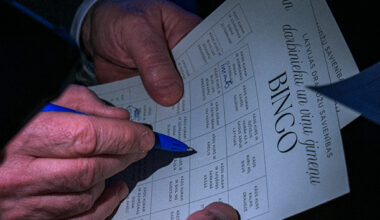 Attendees take part in an interactive game as they move around the room to find people who match different descriptions. The activity was designed to encourage conversation and help employees and family members get to know one another better