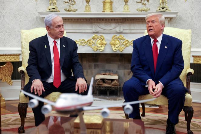 US President Donald Trump talks to Israeli Prime Minister Benjamin Netanyahu during a meeting where Trump announced nuclear talks with Iran, at the White House in Washington, April 7, 2025. 
