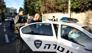 Israel Police officer in a police car