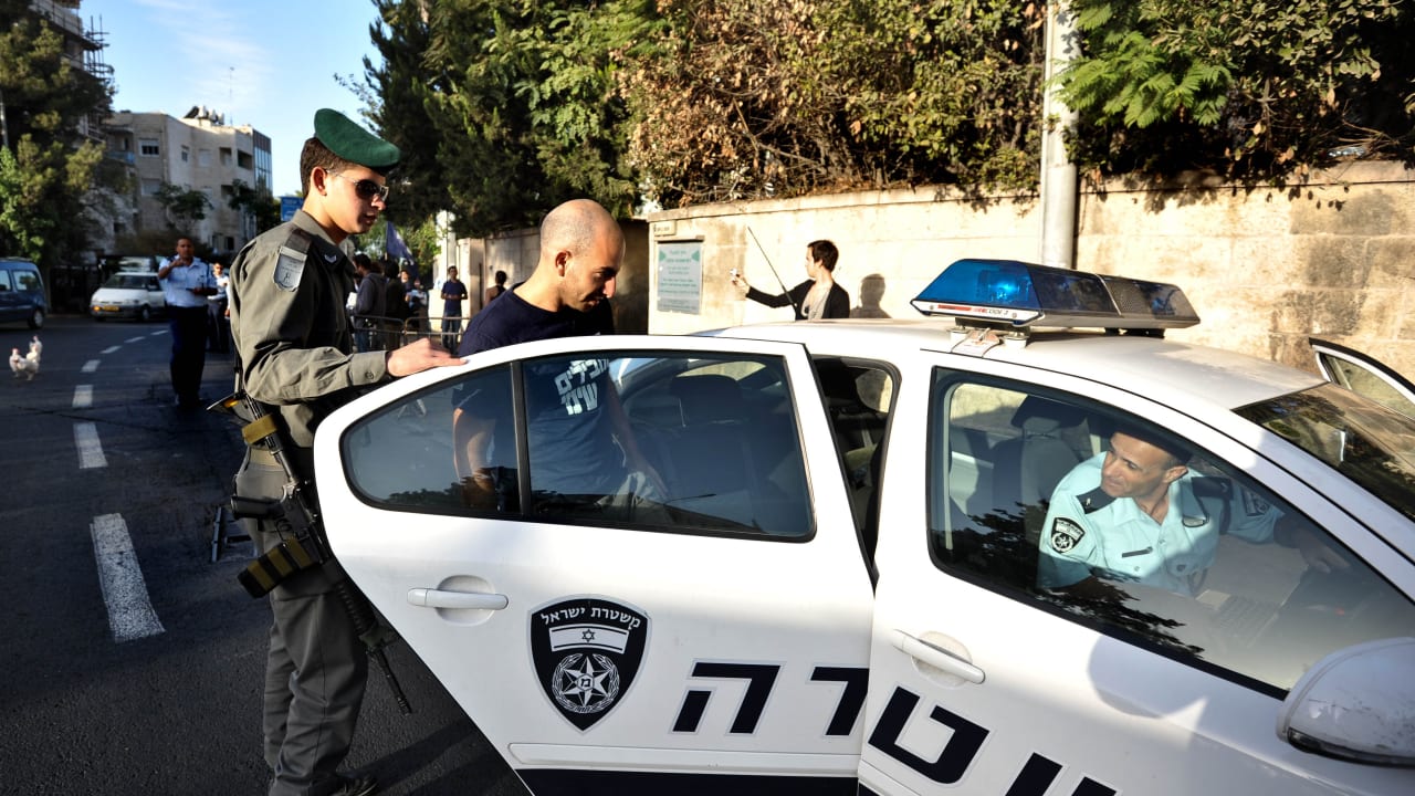 Israel Police officer in a police car