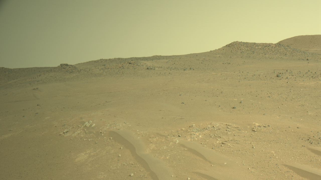 a terrain of red dirt under a reddish-orange sky