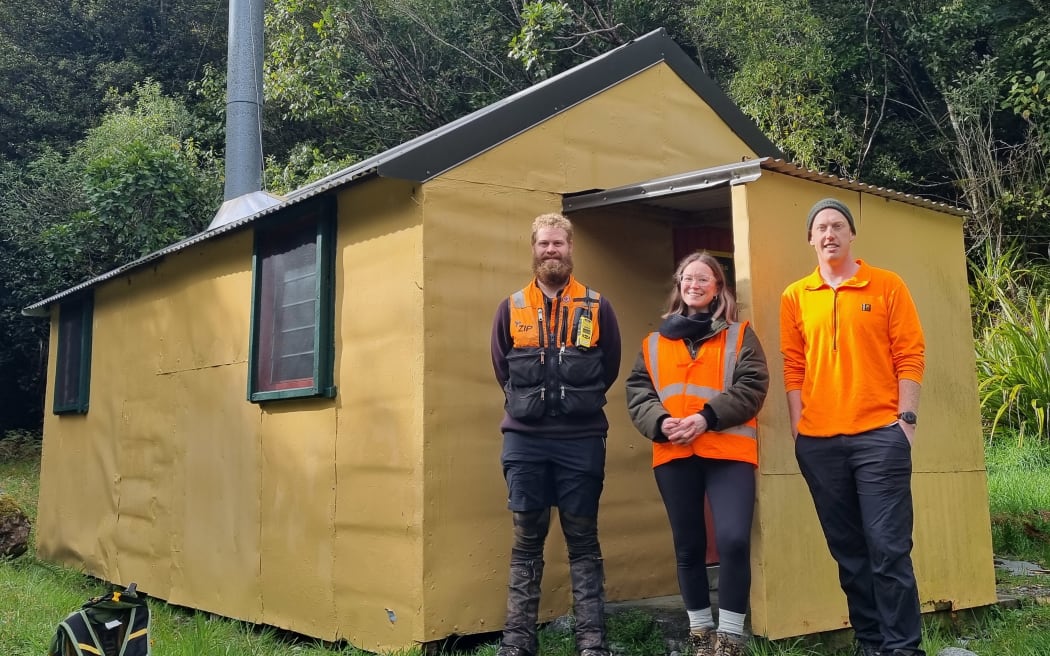 Field ranger Chad Cottle, Zero Invasive Predators' Susannah Aitken and field ranger Ethan Perry at Scone Hut, which was a home base for some workers as they cleared predators from the backcountry.