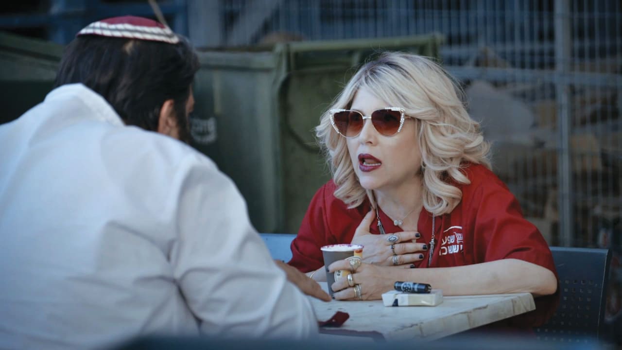 KEREN MOR as Kochava schemes with butcher Nissim, played by Yaniv Swissa.