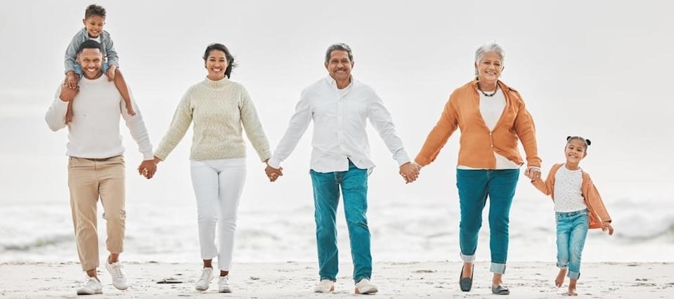 Multi-generation family portrait on the beach.