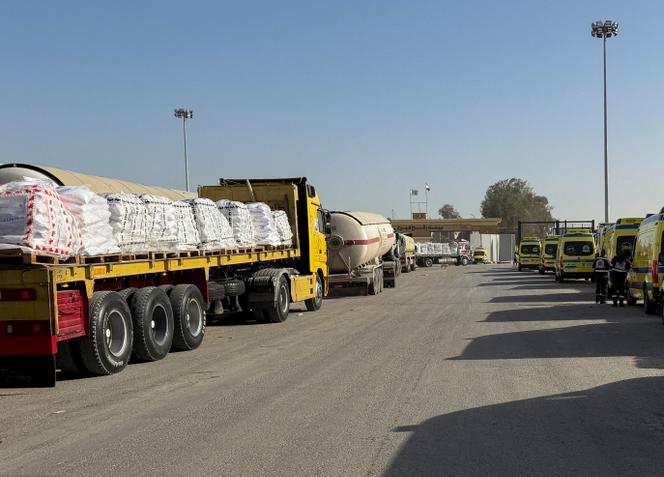 Trucks carrying aid line up next to Egyptian ambulances before transporting supplies into the Gaza Strip through the Rafah border crossing on the Egyptian side, in Rafah, Egypt, February 2, 2026. 