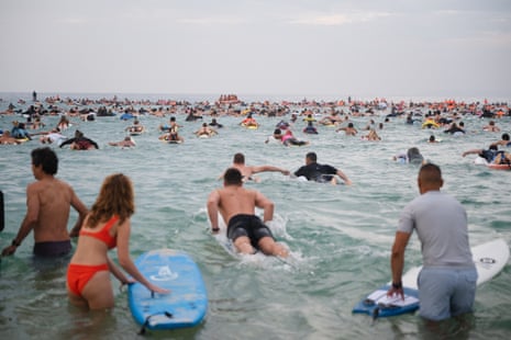 Sydney bathers and surfers paddle out to honour the life of 12-year-old shark victim Nico Antic