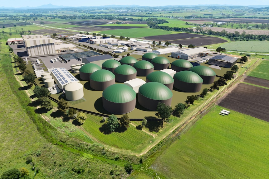 A 3-d rendering showing a group of silos and factory buildings in a rural setting