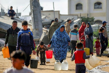 People fill up water containers from a mobile cistern in the Maghazi camp for Palestinian refugees in the central Gaza Strip on February 11, 2026. Credit: Eyad Baba/AFP People fill up water containers from a mobile cistern in the Maghazi camp for Palestinian refugees in the central Gaza Strip on February 11, 2026.