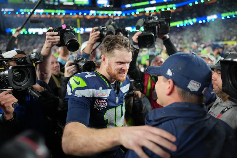 Seattle Seahawks quarterback Sam Darnold celebrates with head coach Mike Macdonald. Photograph: Doug Mills/The New York Times
                      