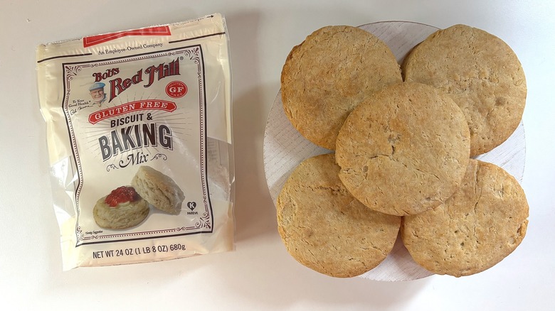 Bag of Bob's Red Mill Gluten Free biscuit and baking mix on table next to biscuits