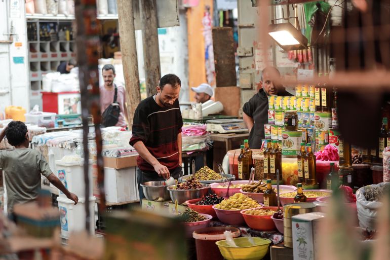 A man stands in a market