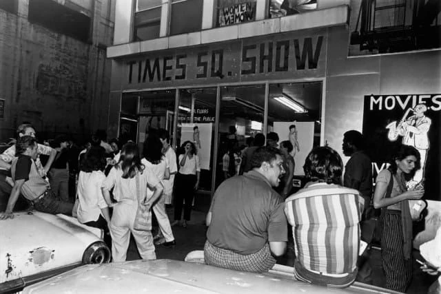 Photo of a group of people outside a building during the “Times Square Show”
