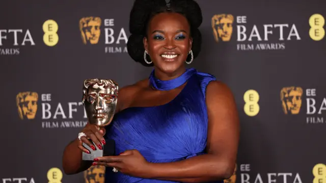 Wunmi Mosaku holds her Bafta award
