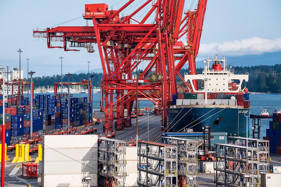 VANCOUVER, BRITISH COLUMBIA, CANADA - 2009/06/26: Docked cargo ship being loaded with  containers for export. (Photo by John Greim/LightRocket via Getty Images)