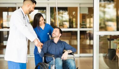 A person being discharged from  hospital ba a doctor and a nurse.