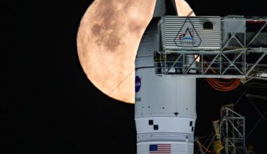 A full Moon is seen shining over NASA’s SLS (Space Launch System) and Orion spacecraft, atop the mobile launcher in the early hours of February 1, 2026. The rocket is currently at Launch Pad 39B at NASA’s Kennedy Space Center in Florida, as teams are preparing for a wet dress rehearsal to practice timelines and procedures for the launch of Artemis II.