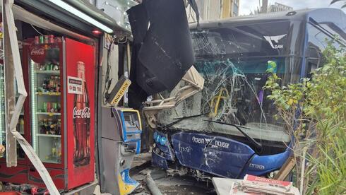 Bus crashes into shop in Ramat Gan, injuring 10; woman critically hurt