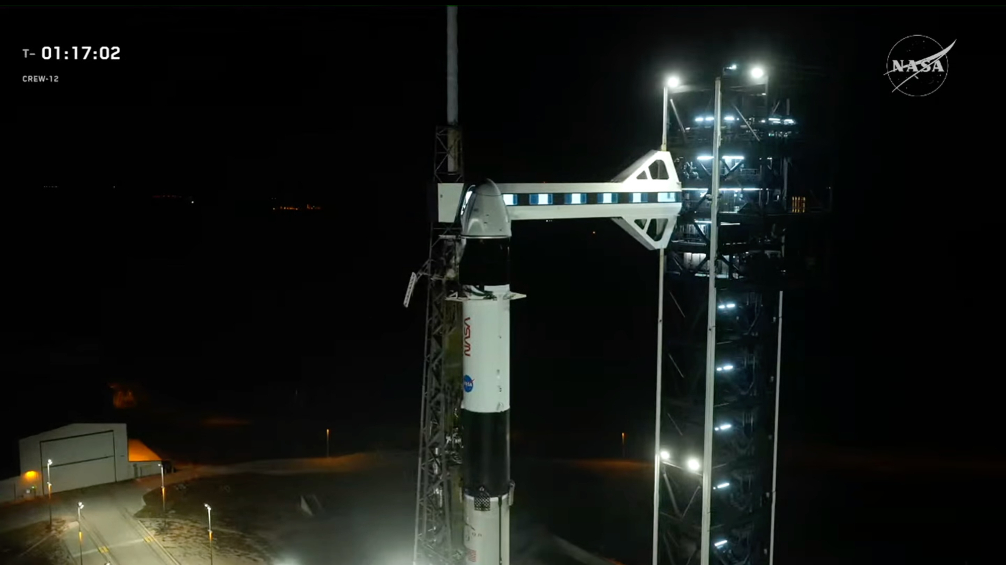 The SpaceX Falcon 9 rocket and Crew Dragon capsule that will fly the Crew-12 mission stand on the pad on launch day, Feb. 13, 2026.