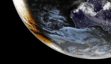 The shadow of the moon is visible over Earth's southern surface to the left of the line separating night from day.