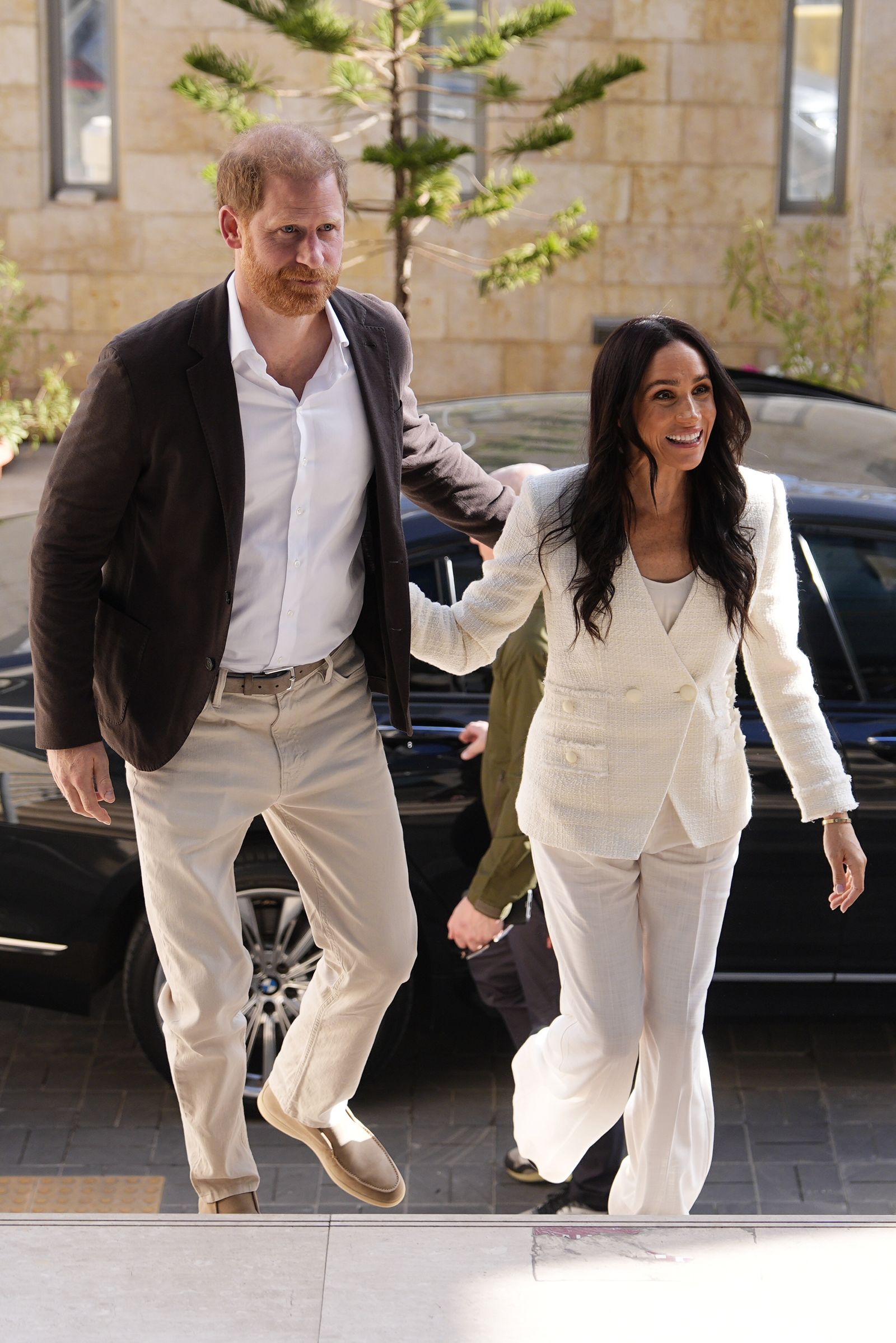 Image may contain Prince Harry Duke of Sussex Meghan Duchess of Sussex Body Part Hand Person Holding Hands and Adult