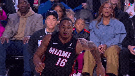 Keshad Johnson goes between his legs while soaring underneath the backboard for the one-handed jam.