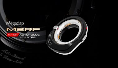 A black and silver Megadap M2RF autofocus adapter is displayed prominently on a dark background, with the product name and logo in bold white and gold text beside it.