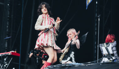 The Last Dinner Party take us on “the endless carousel of being in a relationship you know you shouldn’t be in” on new ‘Help(2)’ song ‘Let’s Do It Again!’