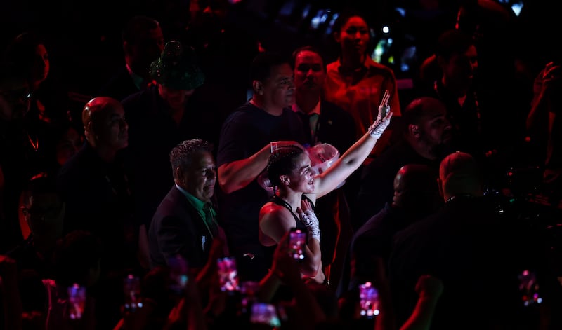 Katie Taylor acknowledges her fans after her victory. Photograph: Gary Carr/Inpho