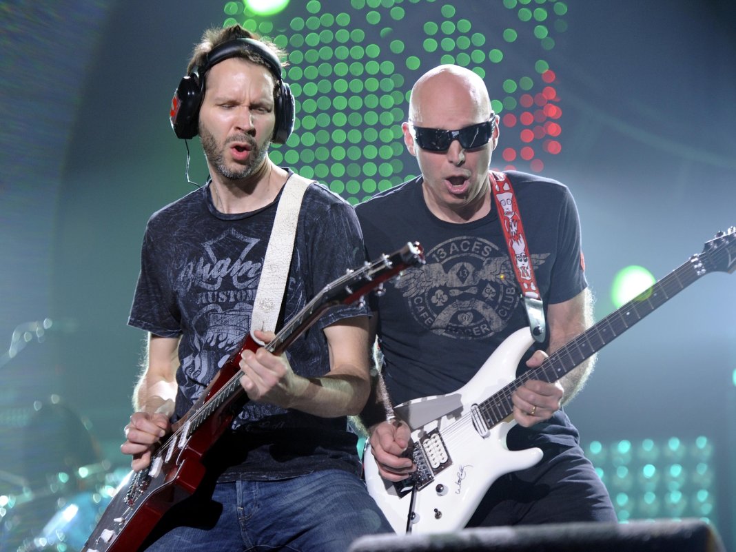“He said, ‘I wish I could let that go, but it’s hard!” Paul Gilbert explains why Joe Satriani feels the need to “prove” he can shred on his records