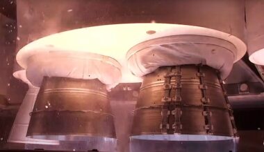 close up view of rocket shortly before liftoff with the engines ignited.