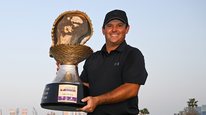 Patrick Reed poses with the trophy following victory on day four of the Qatar Masters 2026 at Doha Golf Club. (Stuart Franklin/Getty Images)