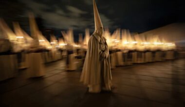A lone penitent walks across Zamora’s Plaza de la Catedral during the Yacente procession at Zamora