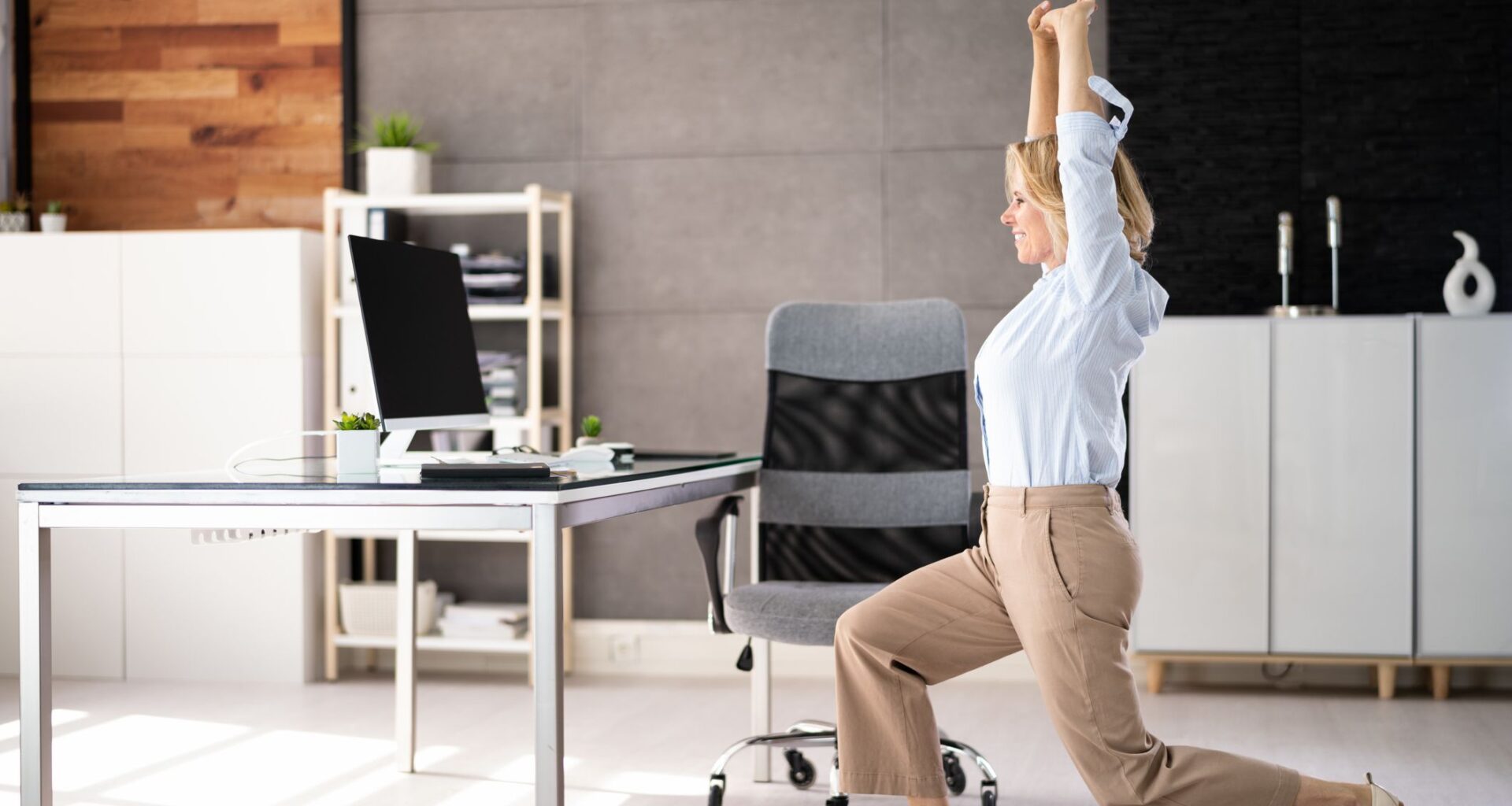 A Johns Hopkins-trained spinal surgeon says these are the two stretches you should be doing if you work at a desk
