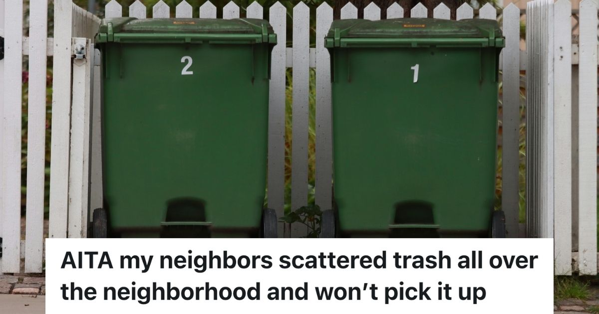 Two trash bins beside a white picket fence