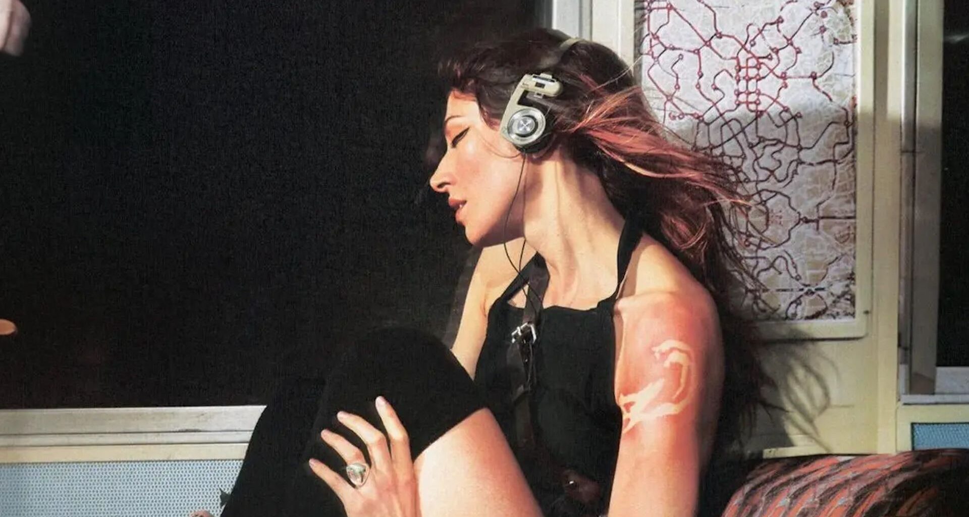Caroline Polachek wearing Koss Porta Pro on the album cover for Desire, I Want to Turn Into You (Everasking Edition)