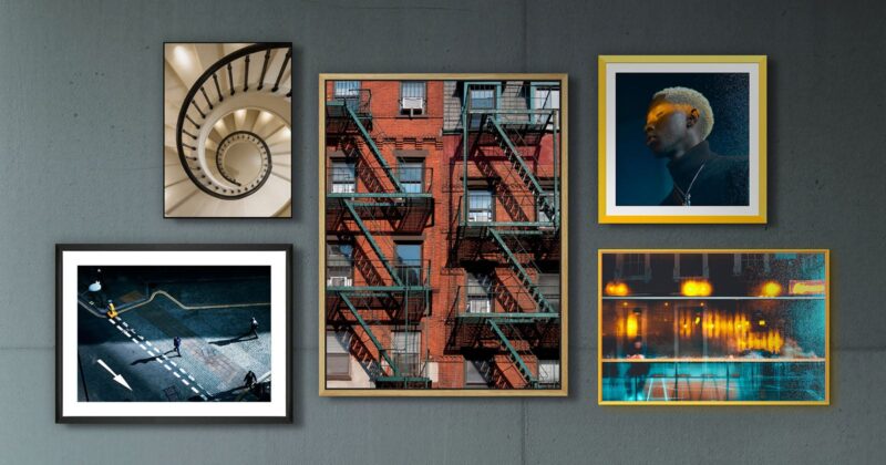 A collage of five framed photos on a gray wall, featuring a spiral staircase, a red brick building with fire escapes, a person with blond hair in dramatic lighting, a city street scene, and reflections of lights in water.