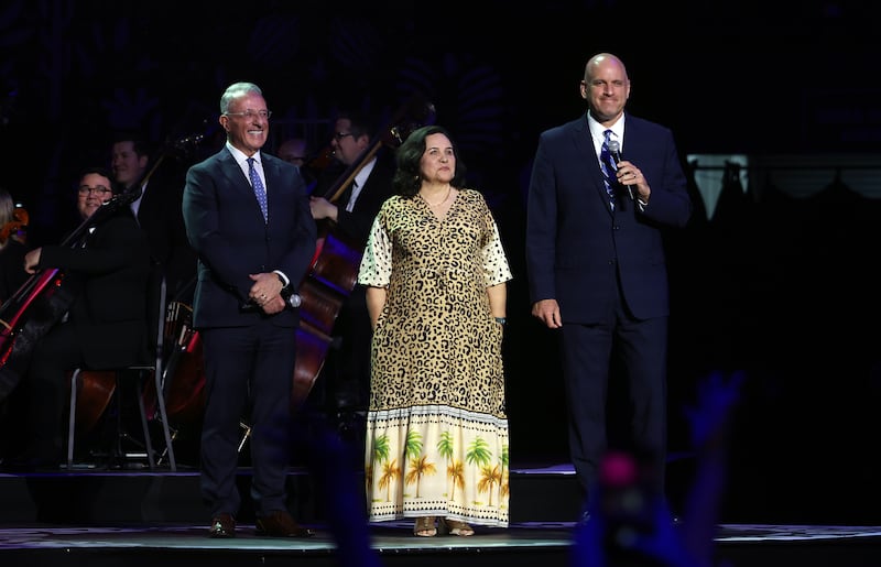 From left, Elder Ulisses Soares of the Quorum of the Twelve Apostles of The Church of Jesus Christ of Latter-day Saints is introduced by Noeli Augusto, Brazil Area consultant, and Elder Mark D. Eddy, General Authority Seventy and second counselor in the Brazil Area presidency, during the "Songs of Hope" tour concert by The Tabernacle Choir and Orchestra at Temple Square at Ginasio do Ibirapuera in São Paulo Brazil, Friday, Feb. 27, 2026.