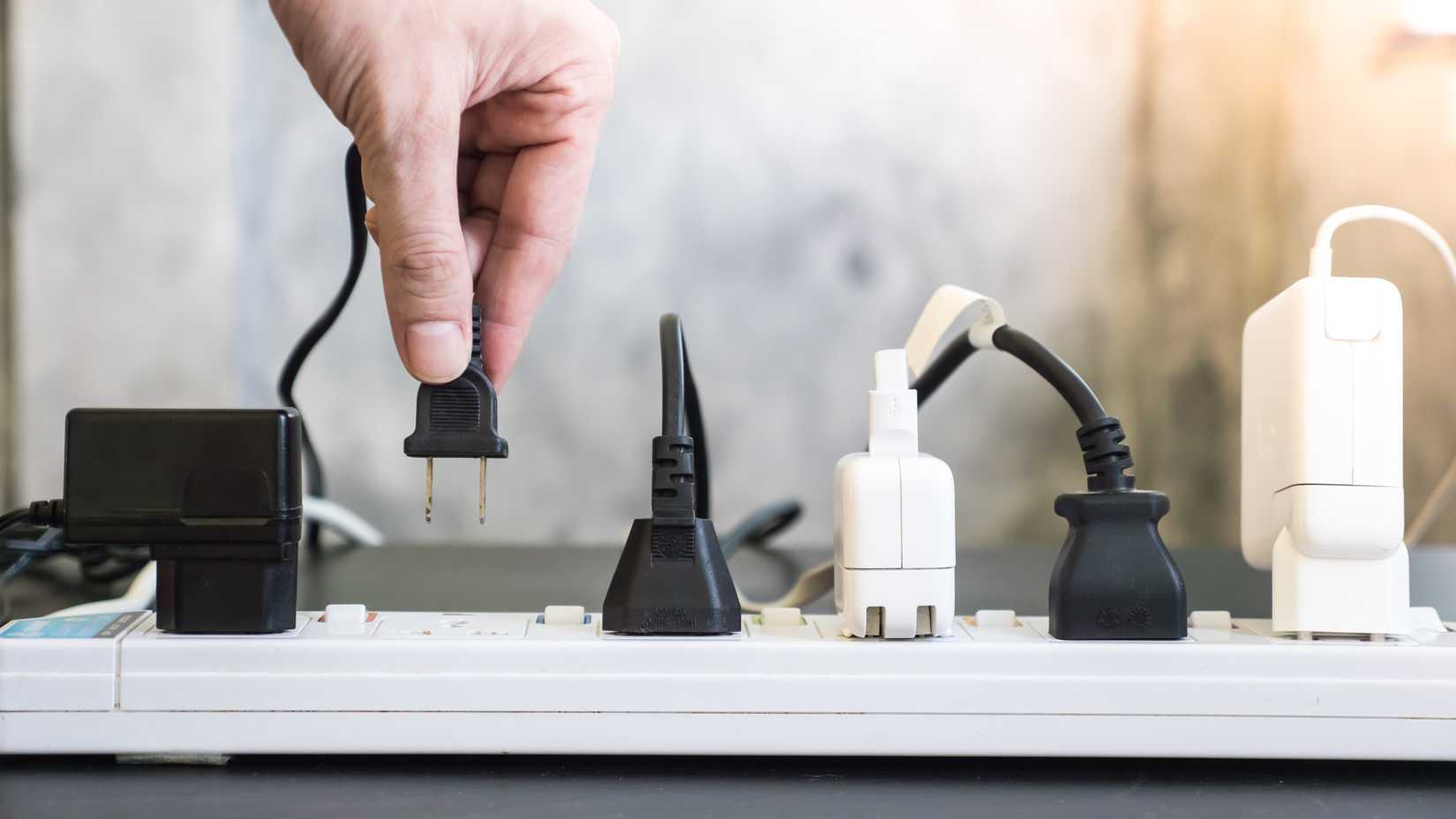 A power board with AC plugs and DC adapters in the sockets.