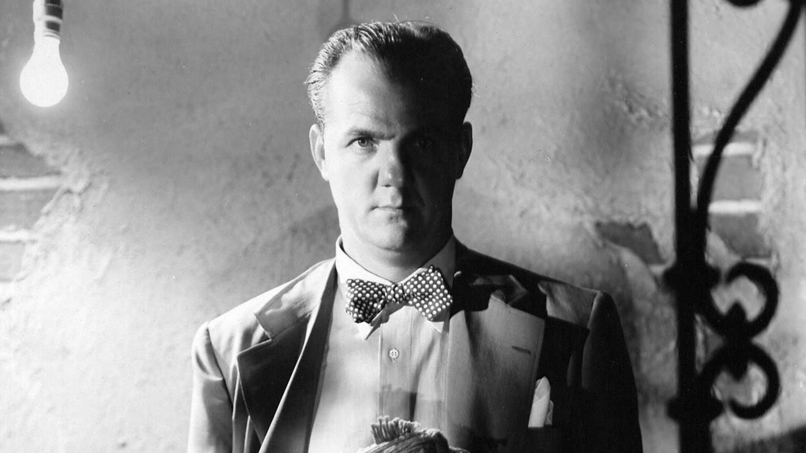 Karl Malden poses in shadow in a promo image for A Streetcar Named Desire