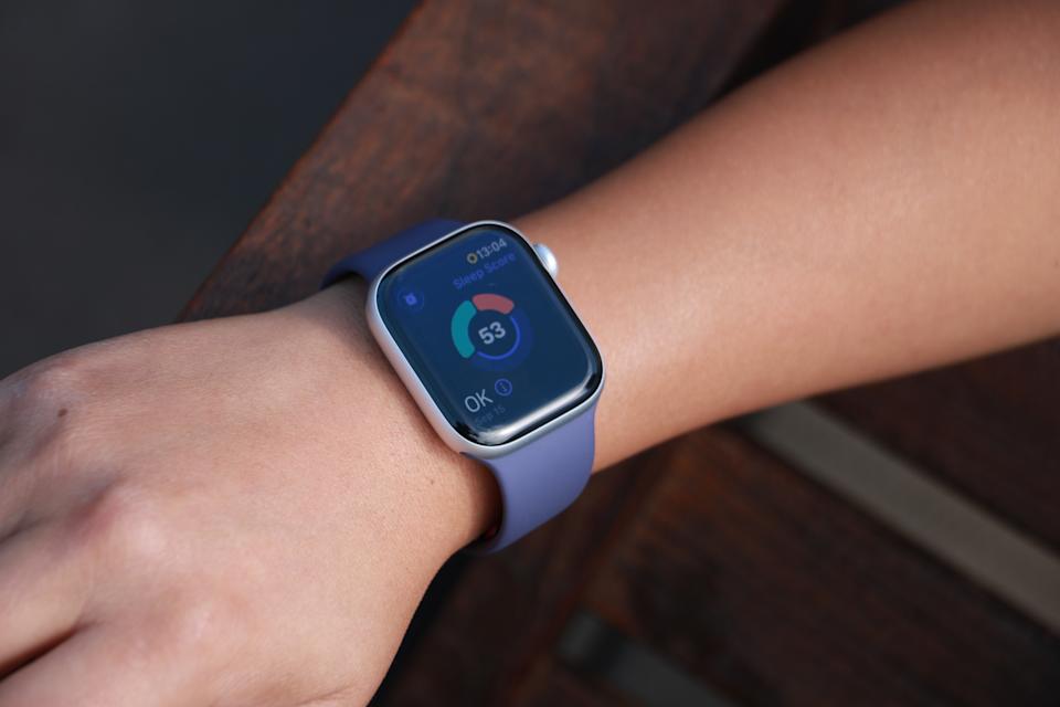 The Apple Watch Series 11 on a person's wrist, showing a ring with three segmented arcs encircling a Sleep Score of 53 and the description "OK" in the bottom left.