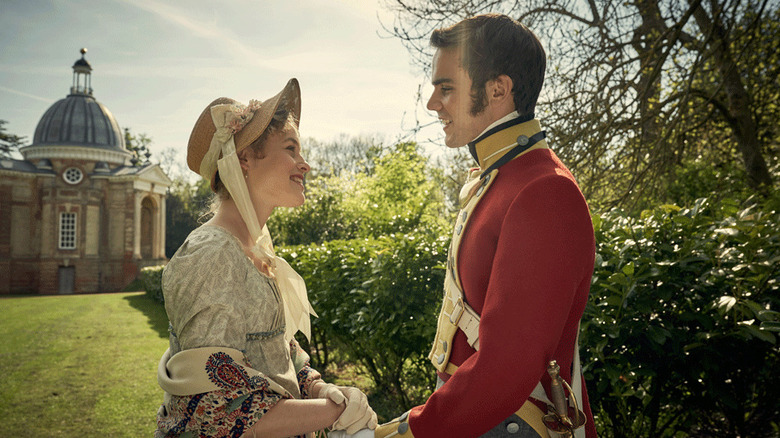 Sophia Trenchard (Emily Reid) happily holds hands with Edmund Bellasis (Jeremy Neumark Jones) in a sunny yard in Belgravia