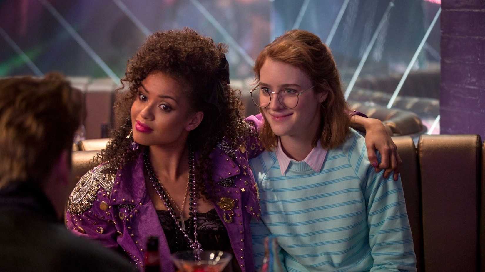 Two women dressed in 80s fashion from the Black Mirror episode "San Junipero."
