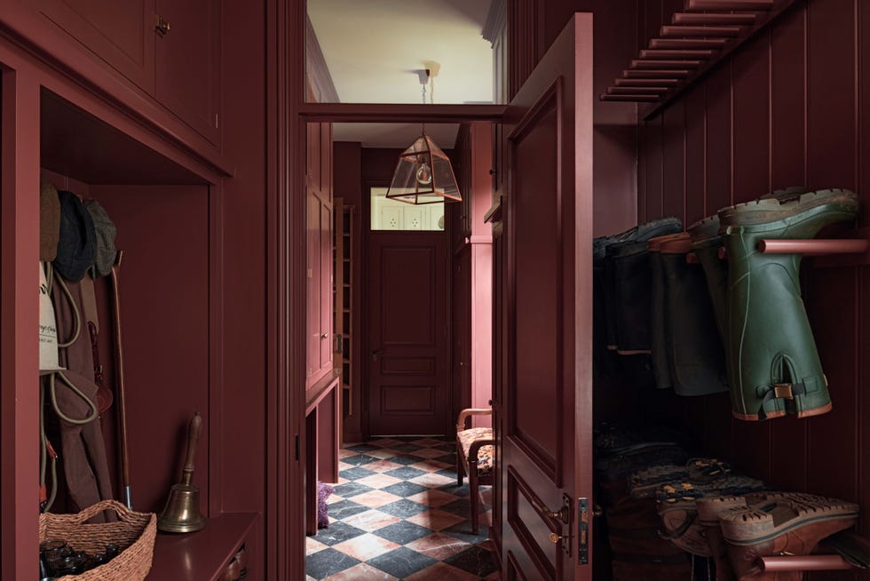 Interior hallway with storage space and footwear.