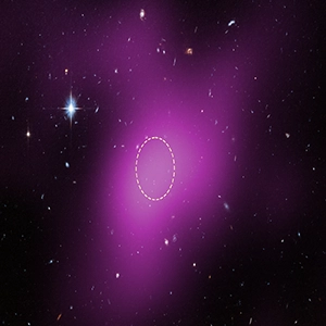 This image shows the location of Cloud-9 dark matter gas cloud, which is 14 million light-years from Earth. The diffuse magenta is radio data from the ground-based Very Large Array (VLA) showing the presence of the cloud. The dashed circle marks the peak of radio emission, which is where researchers focused their search for stars. Credit: Hubble/NASA