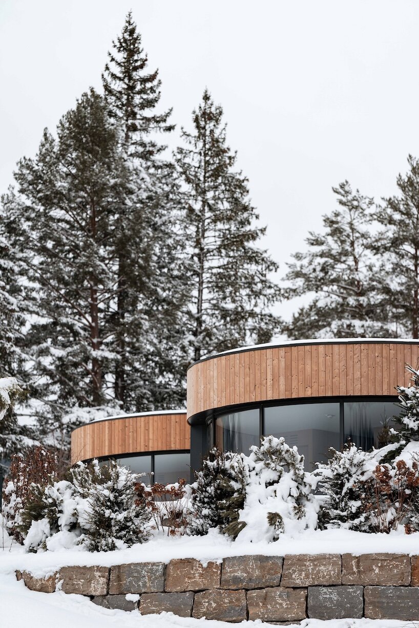curved cabins show off 180 degree mountain view at sonnenalp resort in southern germany