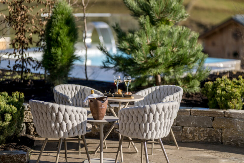 curved cabins show off 180 degree mountain view at sonnenalp resort in southern germany