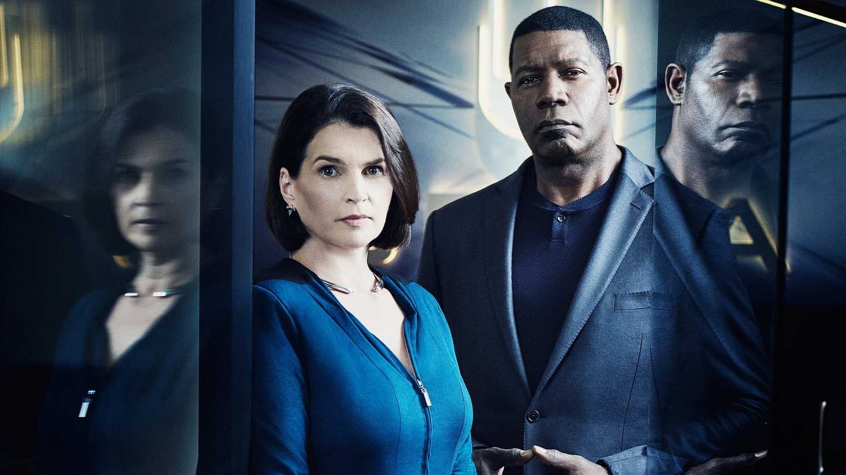 A man and woman in front of a closing elevator in the cyberpunk series Incorporated.