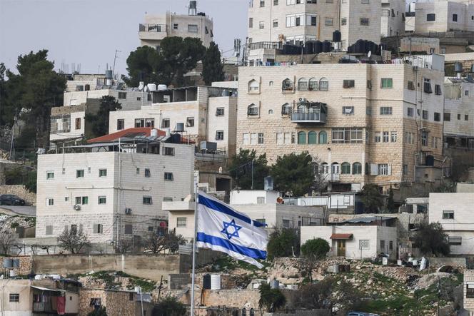 An Israeli flag flies above the Beit Romano settlement in the city of Hebron, West Bank,  February 9, 2026.