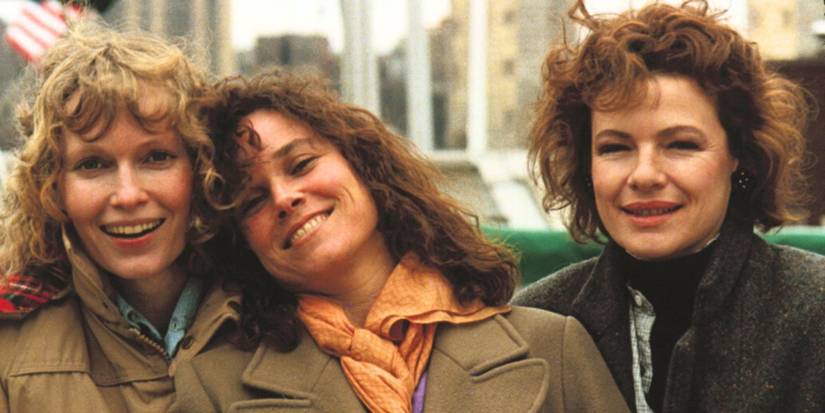Mia Farrow, Barbara Hershey, and Dianne Wiest smiling for the camera in Hannah and Her Sisters.