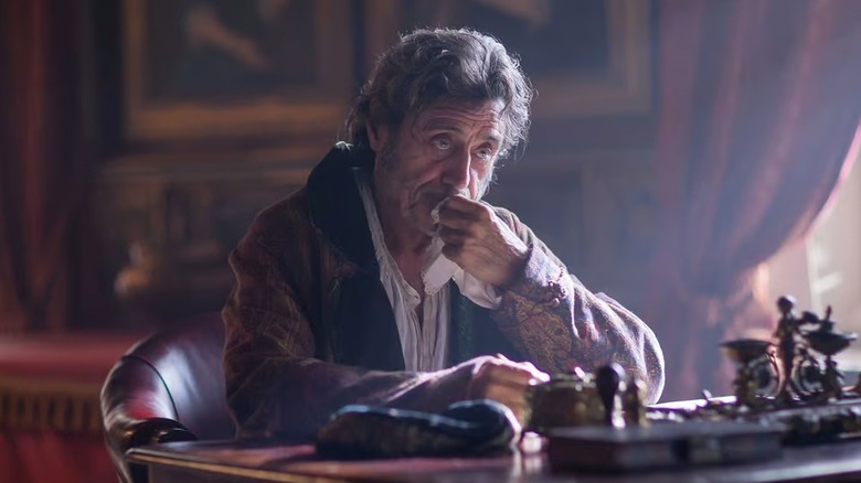 Roger Scatcherd (Ian McShane) sits pensively at a desk in Doctor Thorne